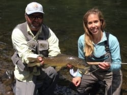 Kat gets a trout. Guiding Paul McDonald, photo Nathaniel Linville