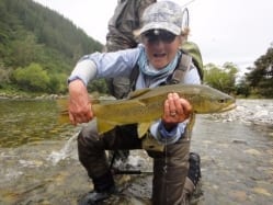 Vicky with a great brown trout from NZ, photo Kathryn Vallilee. Guiding Derek Nees