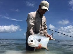 Ian Slater clicks a picture of a nice permit. Guiding/photo Captain Ian Slater