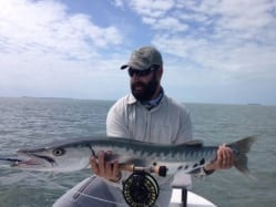 Nathaniel holds the distraction from permit fishing in cold water. Guiding/photo courtesy John O'Hearn