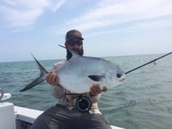 Nathaniel and the second fish of the day with Simon Becker. Photo/guiding Captain Simon Becker