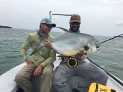 Nat and Simon hold up a good fish on a tough day. Kat Vallilee photo, guiding Simon Becker.