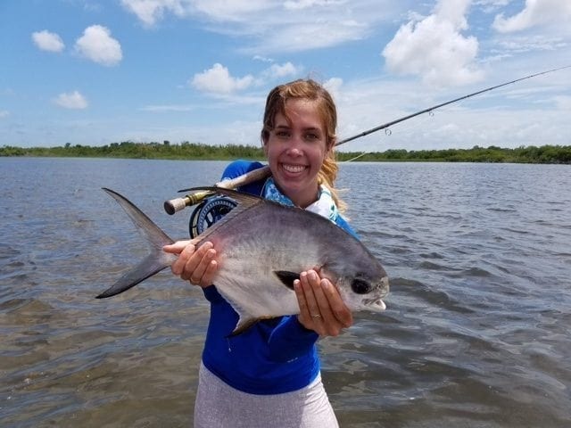 Kathryn holds a potential world record: a permit on 4 pound tippet. Guiding Eworth Garbutt, Photo Nathaniel Linville